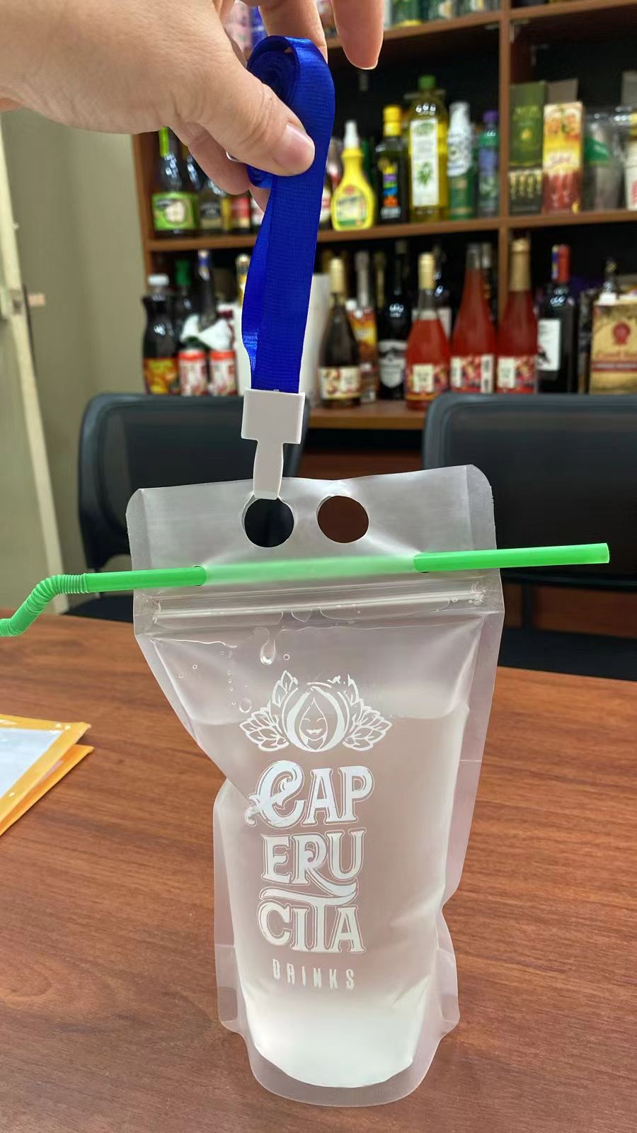 Custom beverage pouch with straw for promotional and retail drinks